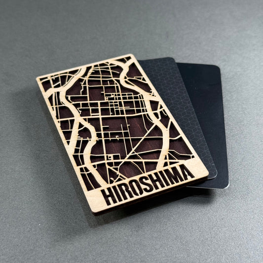 Wooden mini map of Asakusa shown beside credit cards for size comparison