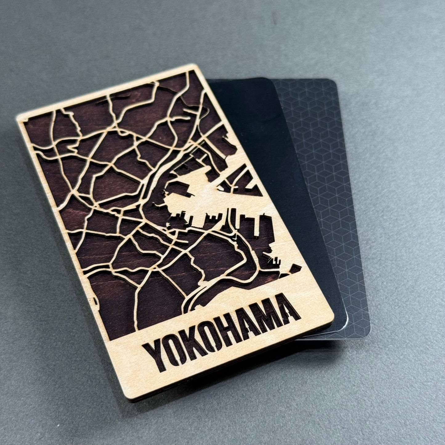 Wooden mini map of Kamakura shown beside credit cards for size comparison