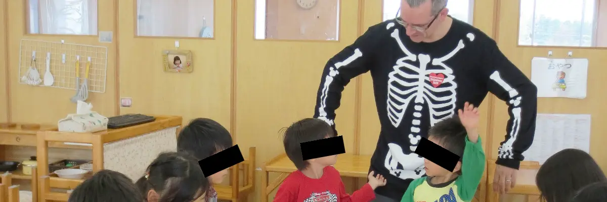Teaching in Japan wearing a Skeleton Costume.