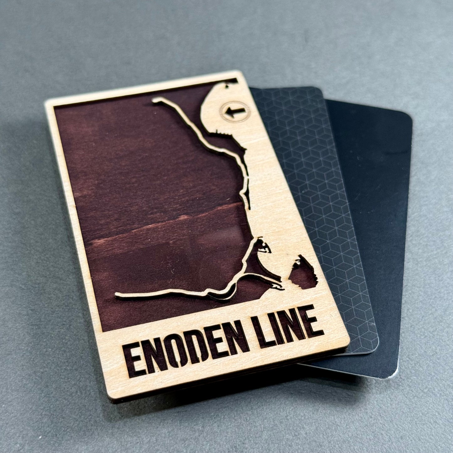 Wooden mini map of the Enoden Line shown beside credit cards for size comparison