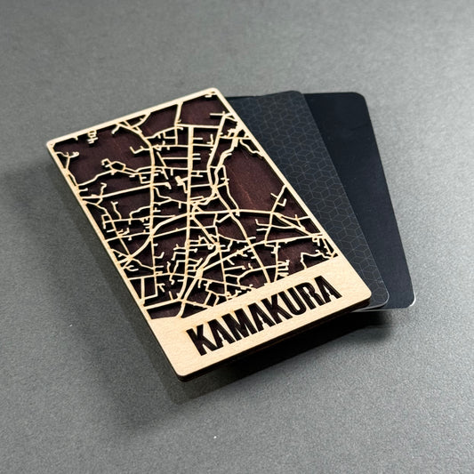 Wooden mini map of Kamakura shown beside credit cards for size comparison