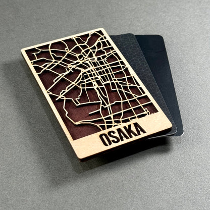 Wooden mini map of Osaka shown beside credit cards for size comparison